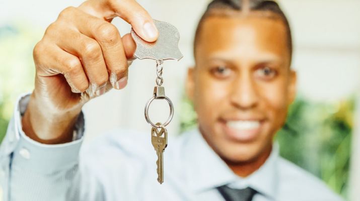 a man holding a key
